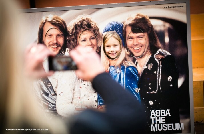 A woman taking photo of ABBA picture. © Anna Bergqvist / Abba The Museum