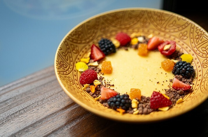 A dessert decorated with strawberry, blueberry and other fruits, served at Michelin star restaurant BOCA